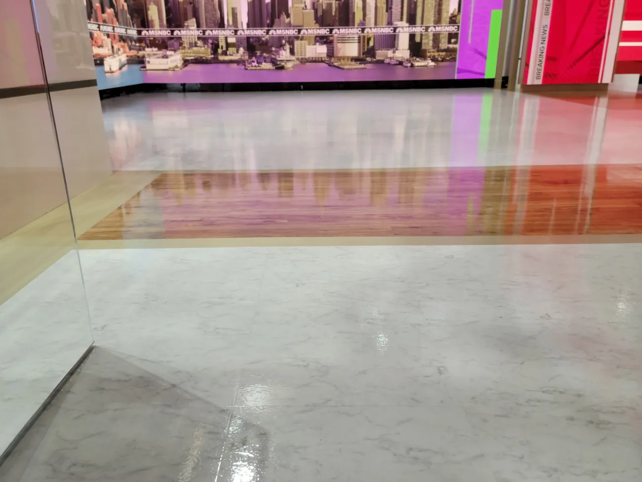 Clear coated studio floor seen through a glass partition